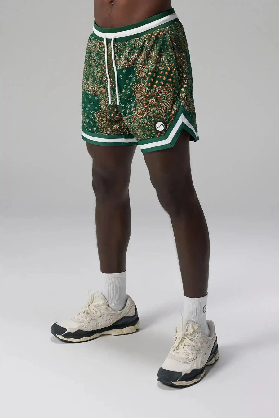 Front View of Green GTS Evolve Mesh 6 Inch Shorts, featuring university of Miami inspired patch paisley design and zipper pockets