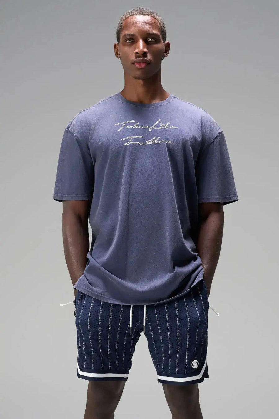 Front View of Blue GTS Evolve Mesh 8 Inch Shorts, featuring an 8-inch inseam, custom pinstripe design and zipper pockets