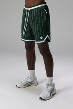Front View of Green GTS Evolve Mesh 8 Inch Shorts, featuring an 8-inch inseam, custom pinstripe design and zipper pockets