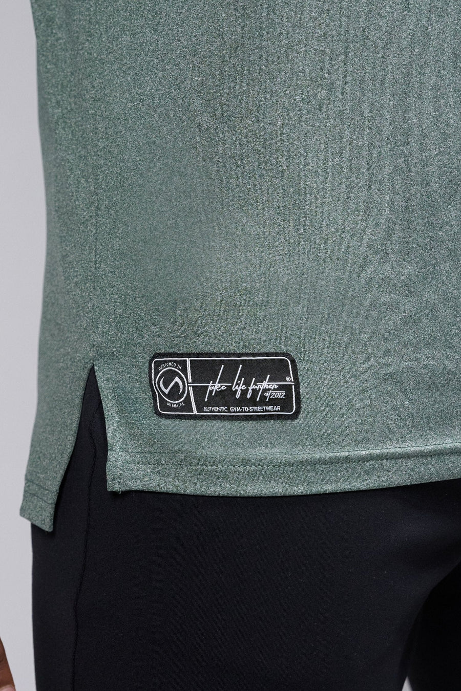 Front View Of the GTS Fitted Henley Long Sleeve in Dark Harvest Green Heather 