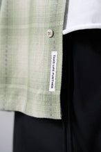 Front View of the Green TLF GTS Flannel Shacket crafted in premium cotton plaid flannel with elevated embroidery details on the collar and back