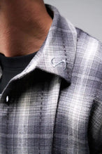 Detail Front View of the Black TLF GTS Flannel Shacket crafted in premium cotton plaid flannel with elevated embroidery details on the collar and back