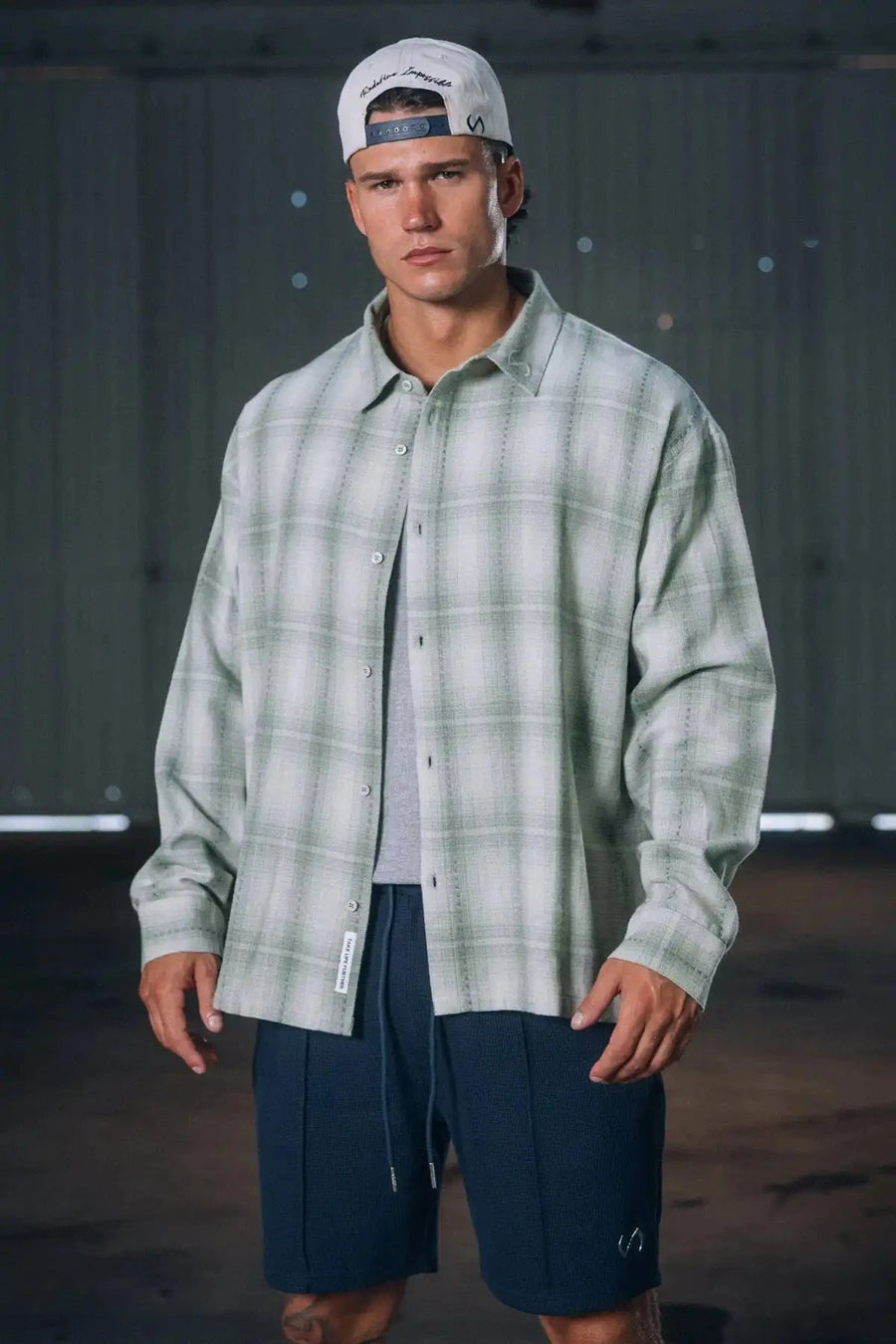 Front View of the Green TLF GTS Flannel Shacket crafted in premium cotton plaid flannel with elevated embroidery details on the collar and back