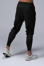 Back View of Black TLF Quad Tech Joggers  featuring a fusion of performance, comfort, and style for the ultimate in mens jogger pants