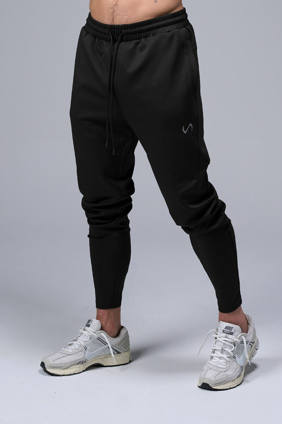 Front View of Black TLF Quad Tech Joggers  featuring a fusion of performance, comfort, and style for the ultimate in mens jogger pants