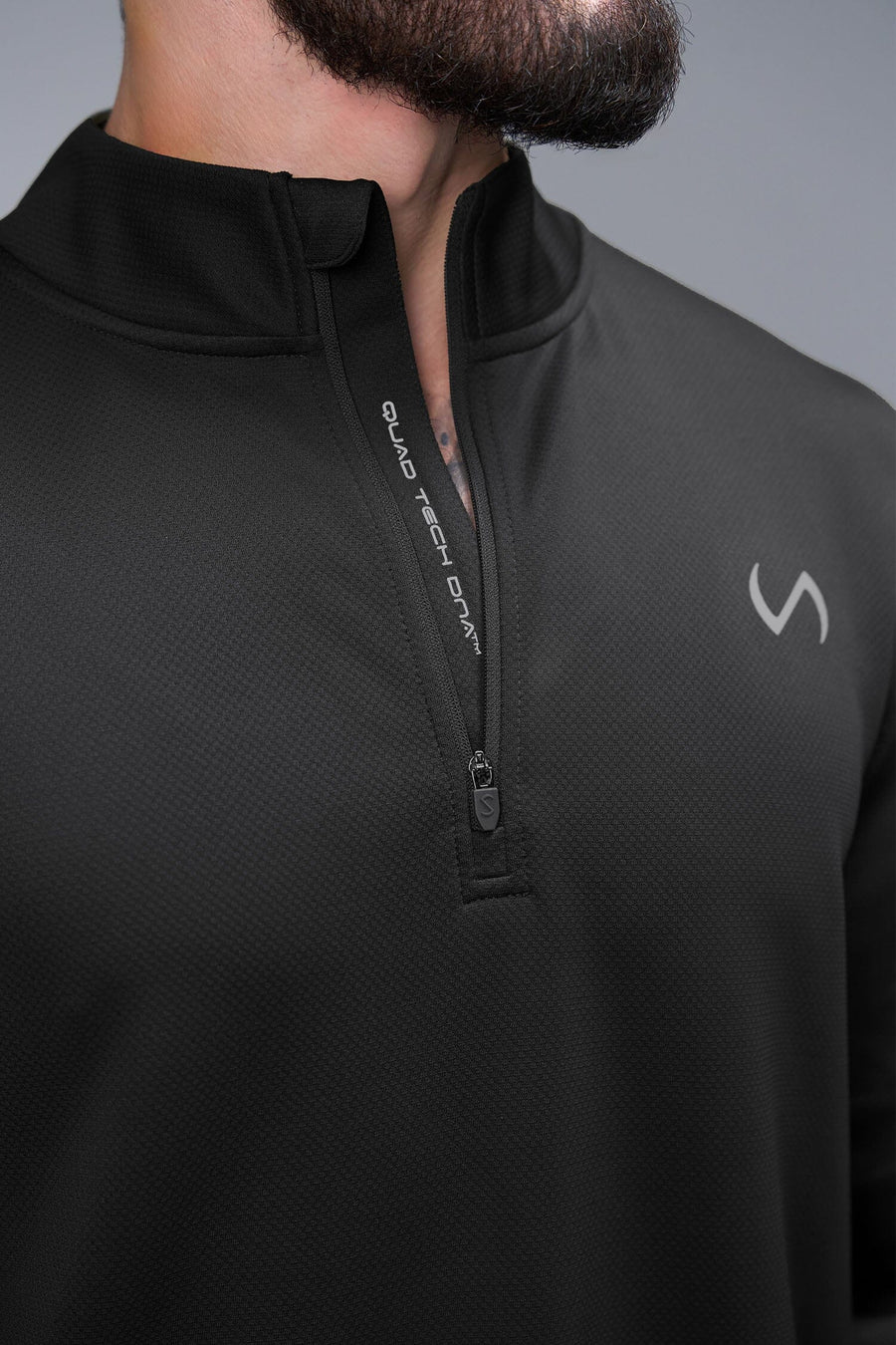Detail Zip View of Black TLF GTS Quad Tech Quarter-Zip Pullover redefining modern activewear, this men’s 1/4 zip pullover blends technology with sleek style 