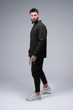 Left Side View of Black TLF GTS Quad Tech Quarter-Zip Pullover redefining modern activewear, this men’s 1/4 zip pullover blends technology with sleek style 