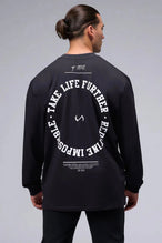 Back View of Black the TLF Redefine Original Cotton Luxe Oversized LS Tee that features a bold back graphic in an oversized fit. 
