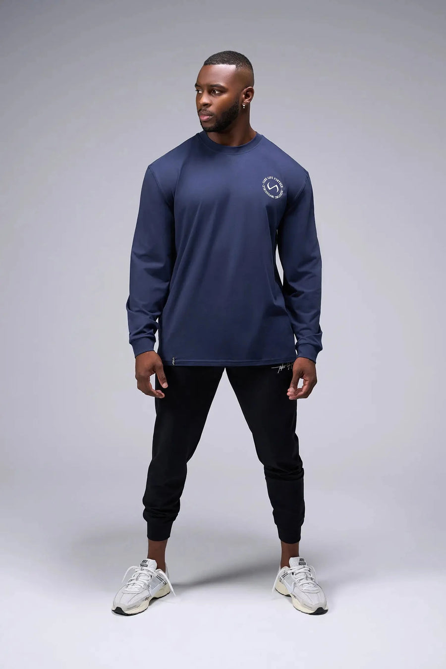 Front View of Blue the TLF Redefine Original Cotton Luxe Oversized LS Tee that features a bold back graphic in an oversized fit. 