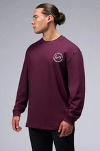 Front View of Red the TLF Redefine Original Cotton Luxe Oversized LS Tee that features a bold back graphic in an oversized fit. 
