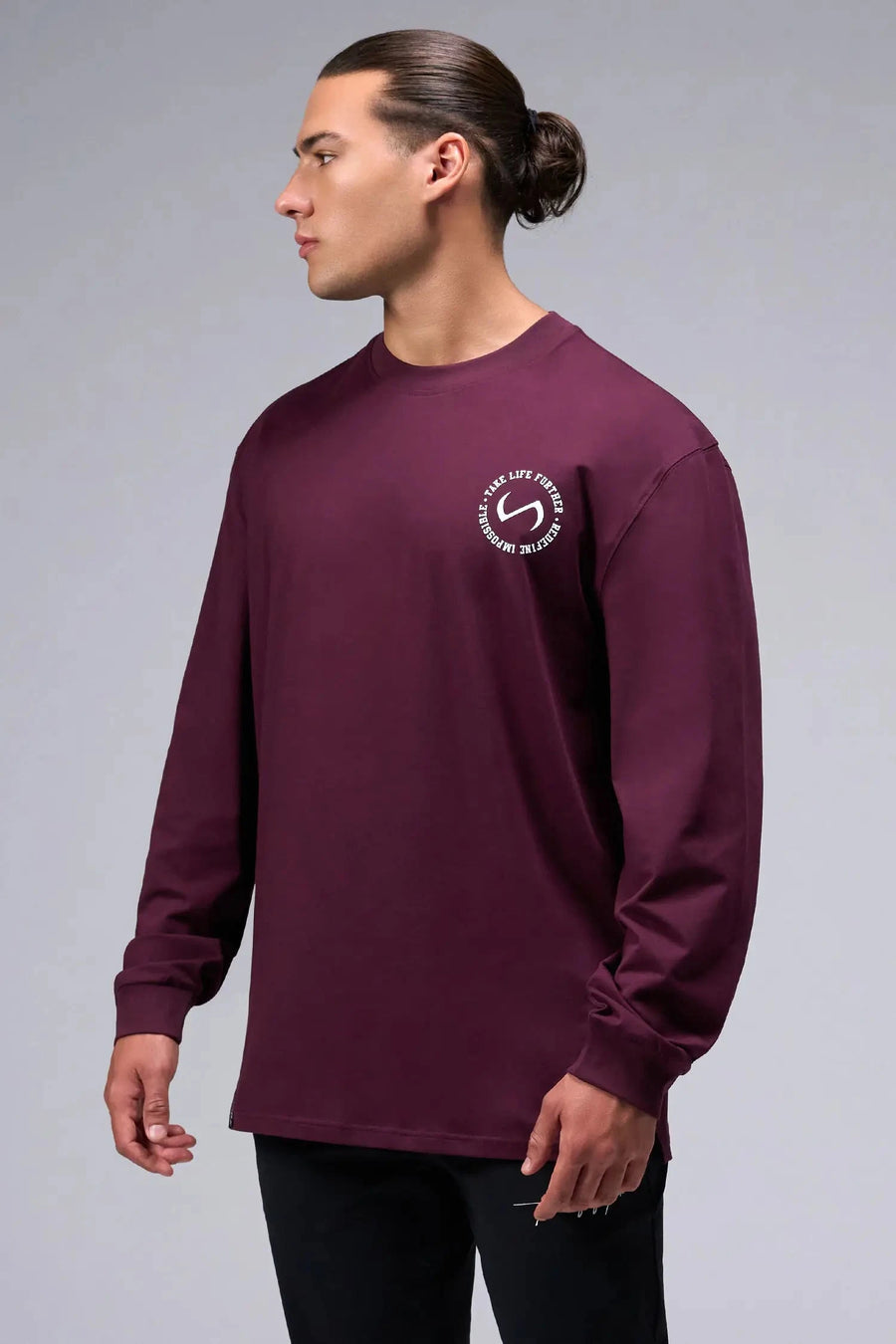 Front View of Red the TLF Redefine Original Cotton Luxe Oversized LS Tee that features a bold back graphic in an oversized fit. 