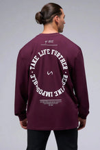 Back View of Red the TLF Redefine Original Cotton Luxe Oversized LS Tee that features a bold back graphic in an oversized fit. 