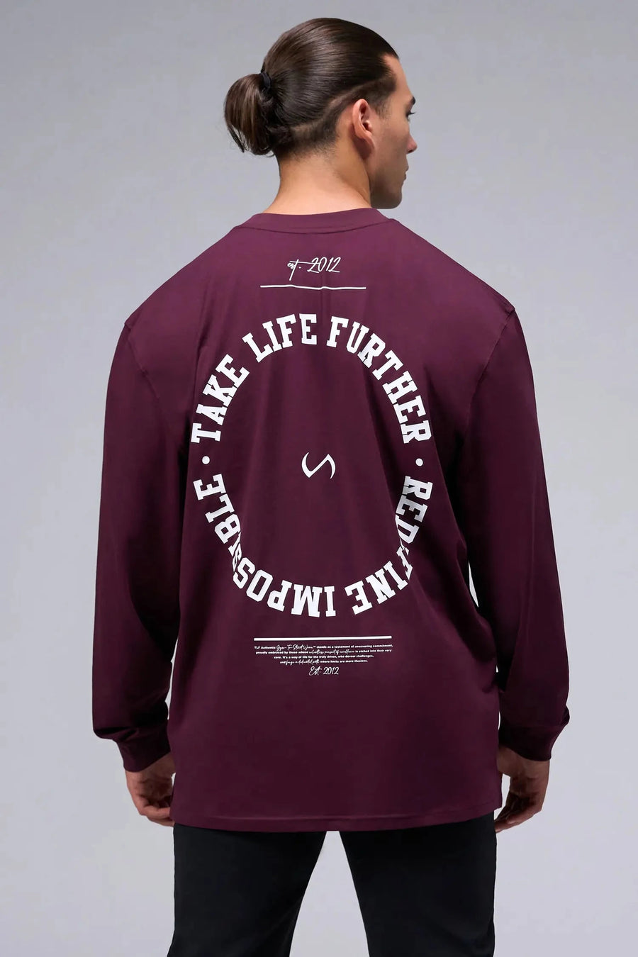 Back View of Red the TLF Redefine Original Cotton Luxe Oversized LS Tee that features a bold back graphic in an oversized fit. 