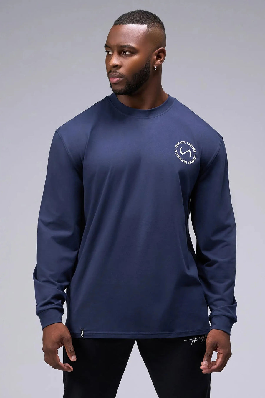 Front View of Blue the TLF Redefine Original Cotton Luxe Oversized LS Tee that features a bold back graphic in an oversized fit. 