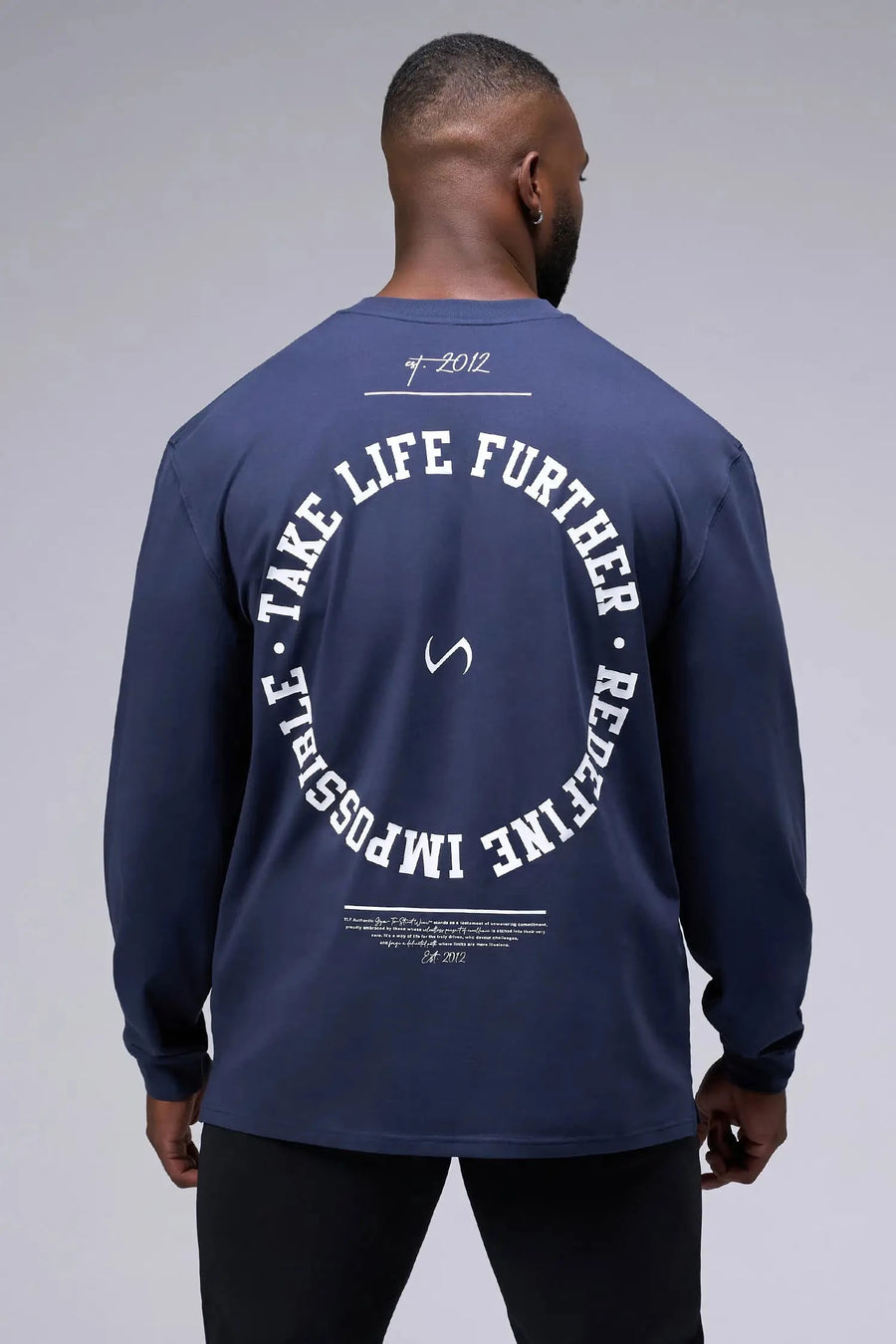 Back View of Blue the TLF Redefine Original Cotton Luxe Oversized LS Tee that features a bold back graphic in an oversized fit. 