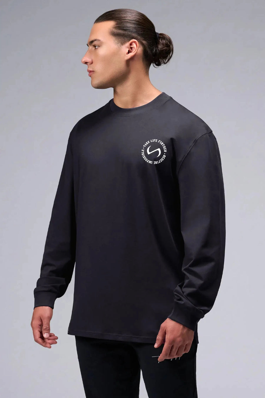 Front View of Black the TLF Redefine Original Cotton Luxe Oversized LS Tee that features a bold back graphic in an oversized fit. 