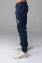 Front View of Blue TLF GTS Scuba Tech Joggers, featuring an athletic relaxed fit with zipper pockets