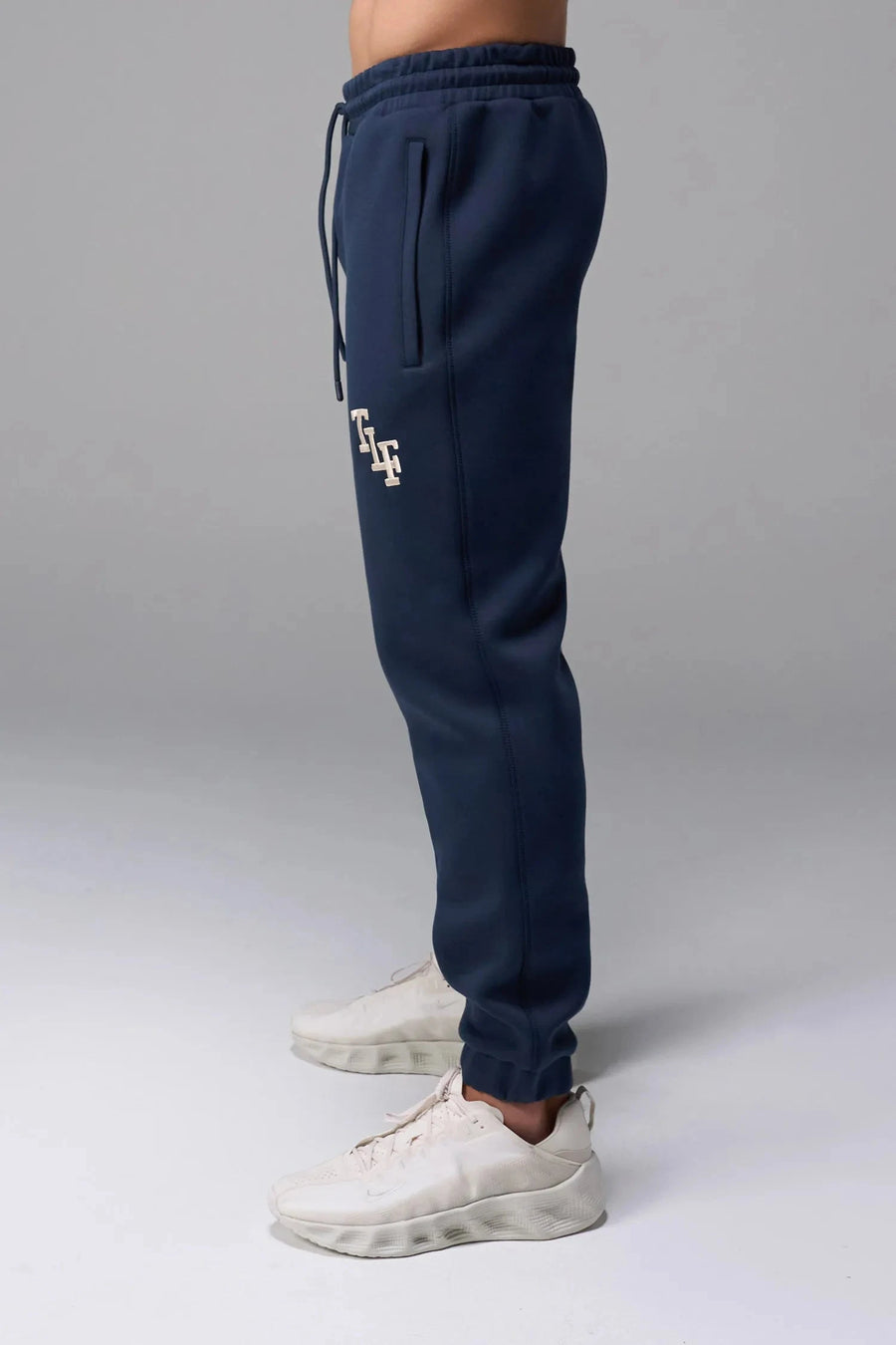 Front View of Blue TLF GTS Scuba Tech Joggers, featuring an athletic relaxed fit with zipper pockets