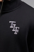 Front View of Black  TLF GTS Scuba Tech Quarter-Zip Pullover, featuring a ¼ zip pullover, sleek design and kangaroo pockets 