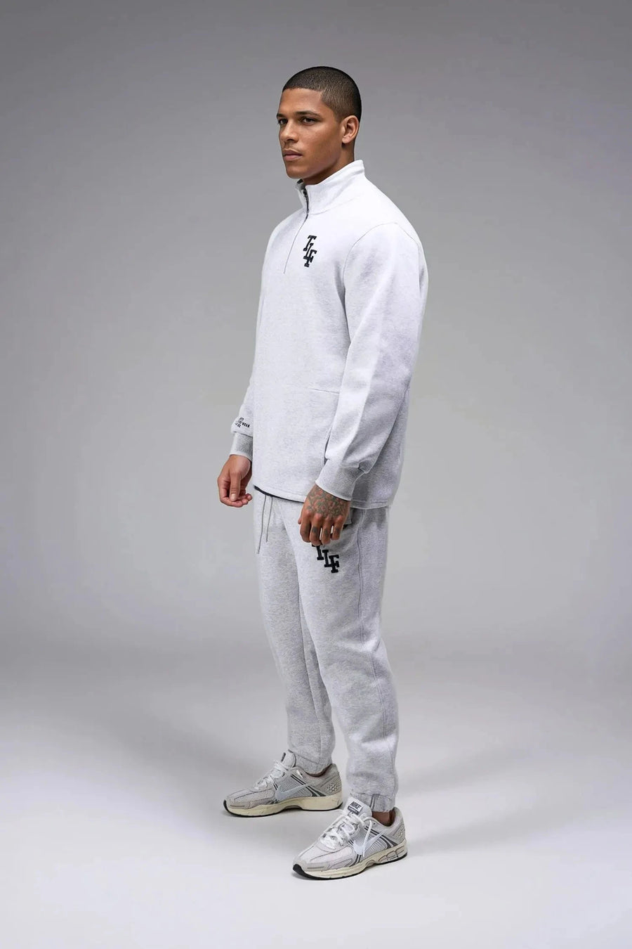 Front View of Gray  TLF GTS Scuba Tech Quarter-Zip Pullover, featuring a ¼ zip pullover, sleek design and kangaroo pockets 