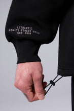 Detail Right Sleeve View of Black TLF GTS Scuba Tech Quarter-Zip Pullover, featuring a ¼ zip pullover, sleek design and kangaroo pockets