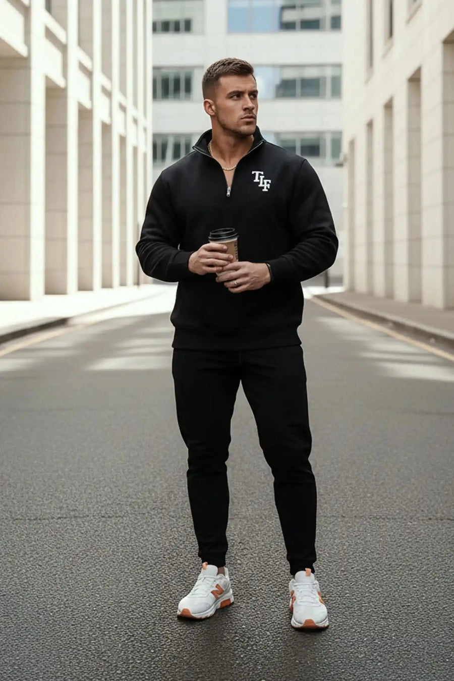 Front View of Black  TLF GTS Scuba Tech Quarter-Zip Pullover, featuring a ¼ zip pullover, sleek design and kangaroo pockets 