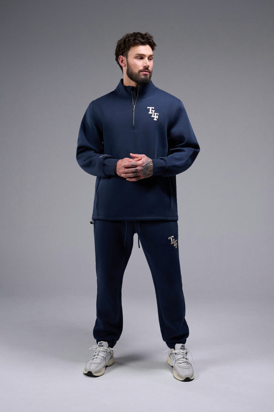 Front View of Blue Nights TLF GTS Scuba Tech Quarter-Zip Pullover, featuring a ¼ zip pullover, sleek design and kangaroo pockets