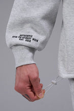 Detail Right Sleeve View of Light Heather Gray TLF GTS Scuba Tech Quarter-Zip Pullover, featuring a ¼ zip pullover, sleek design and kangaroo pockets