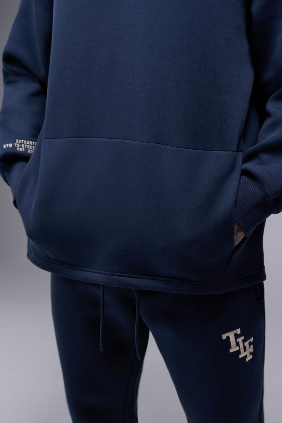 Detail Front View of Blue Nights TLF GTS Scuba Tech Quarter-Zip Pullover, featuring a ¼ zip pullover, sleek design and kangaroo pockets