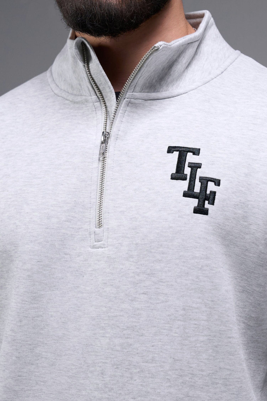 Detail Front View of Light Heather Gray TLF GTS Scuba Tech Quarter-Zip Pullover, featuring a ¼ zip pullover, sleek design and kangaroo pockets