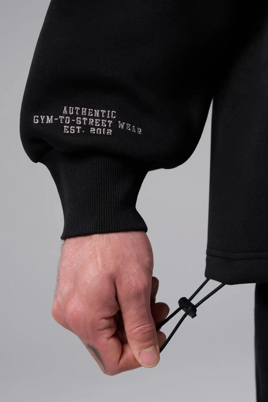 Front View of Black  TLF GTS Scuba Tech Quarter-Zip Pullover, featuring a ¼ zip pullover, sleek design and kangaroo pockets 