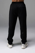 Back View of Black TLF GTS Twill Tech Joggers, featuring contrast stitching, zippered pockets, and next level style and function