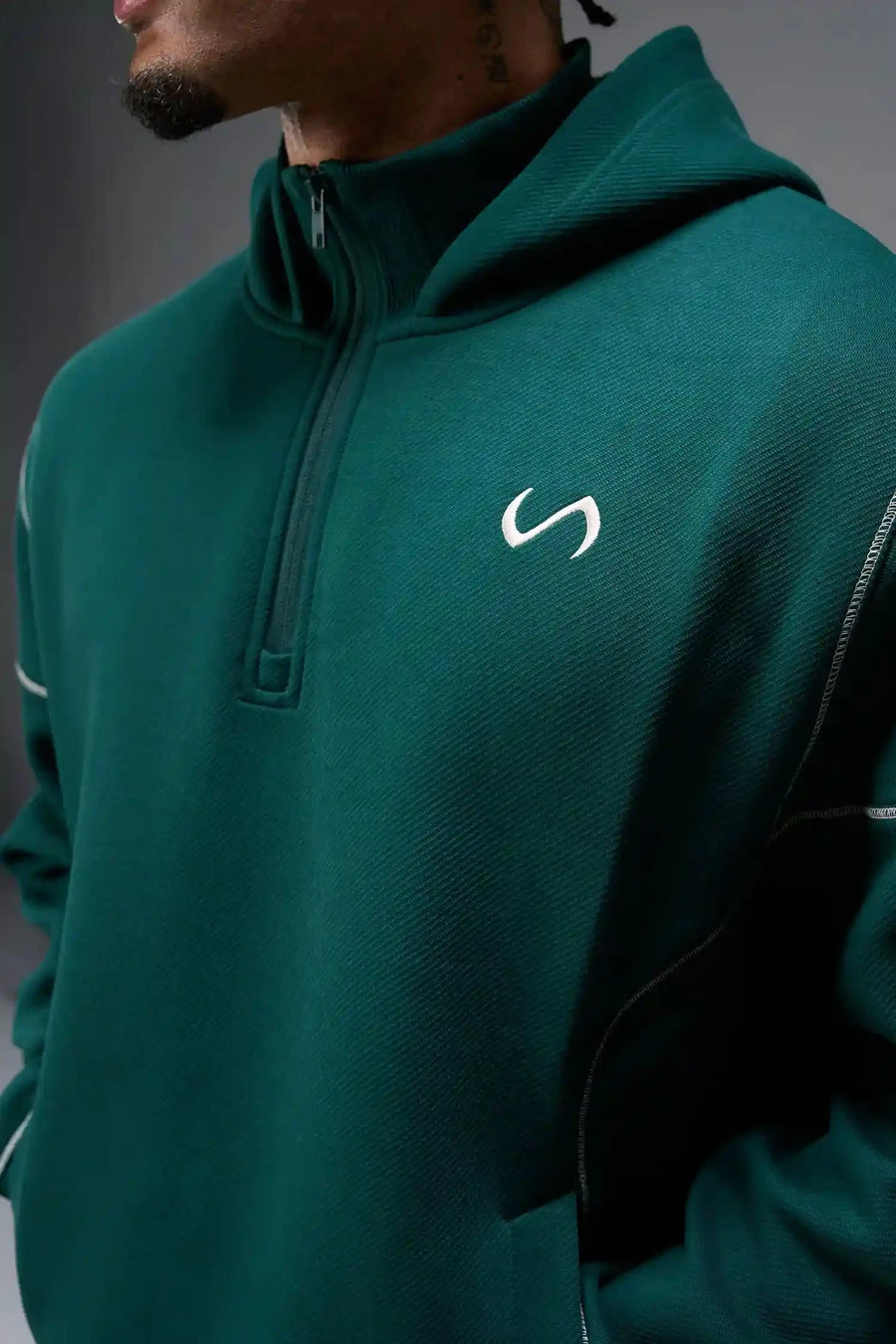 Front View of Green TLF GTS Twill Tech Quarter-Zip Hoodie, featuring contrast stitching, kangaroo pockets and unmatched style
