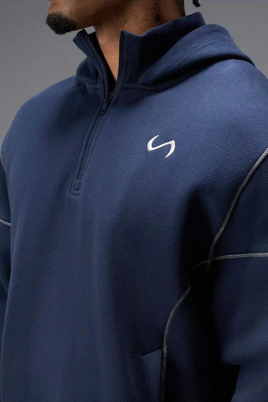 Front View of Blue TLF GTS Twill Tech Quarter-Zip Hoodie, featuring contrast stitching, kangaroo pockets and unmatched style