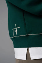 Front View of Green TLF GTS Twill Tech Quarter-Zip Hoodie, featuring contrast stitching, kangaroo pockets and unmatched style