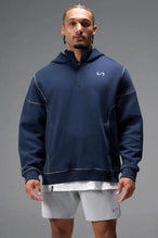 Front View of Blue TLF GTS Twill Tech Quarter-Zip Hoodie, featuring contrast stitching, kangaroo pockets and unmatched style