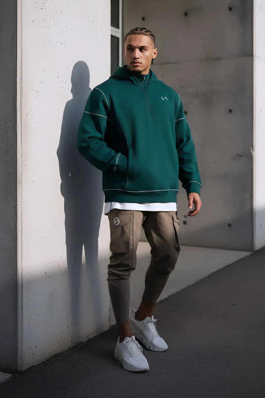 Front View of Green TLF GTS Twill Tech Quarter-Zip Hoodie, featuring contrast stitching, kangaroo pockets and unmatched style