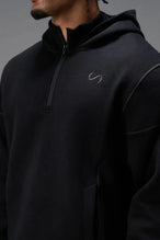 Front View of Black TLF GTS Twill Tech Quarter-Zip Hoodie, featuring contrast stitching, kangaroo pockets and unmatched style