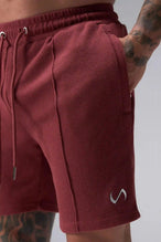 Detail View of Red TLF GTS Waffle Tech Shorts, featuring a 7 Inch inseam, an athletic relaxed fit with zipper pockets designed for all day wear