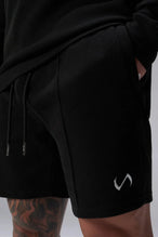 Detail View of Black TLF GTS Waffle Tech Shorts, featuring a 7 Inch inseam, an athletic relaxed fit with zipper pockets designed for all day wear