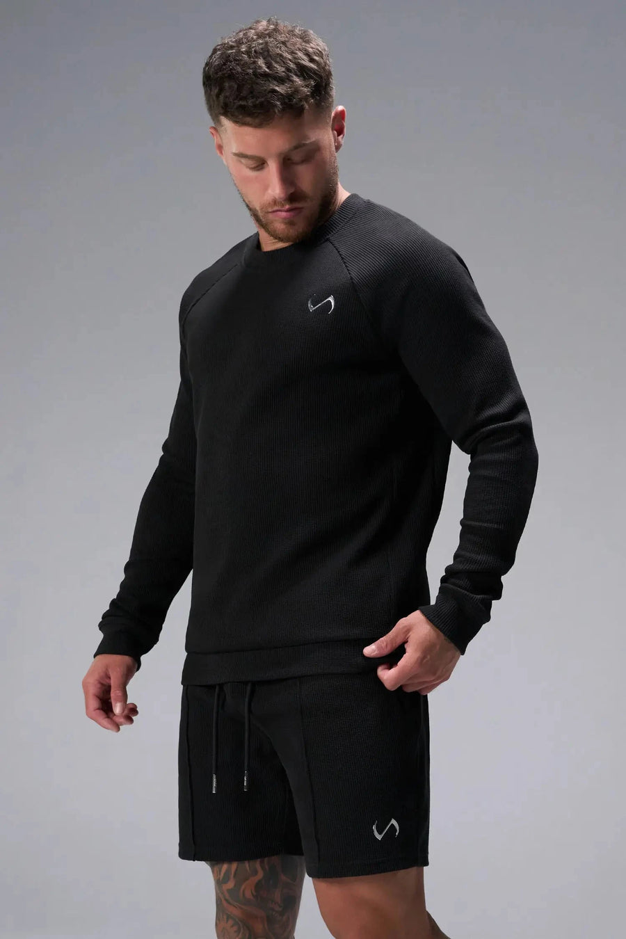 Front View of Black TLF GTS Waffle Tech Shorts, featuring a 7 Inch inseam, an athletic relaxed fit with zipper pockets designed for all day wear