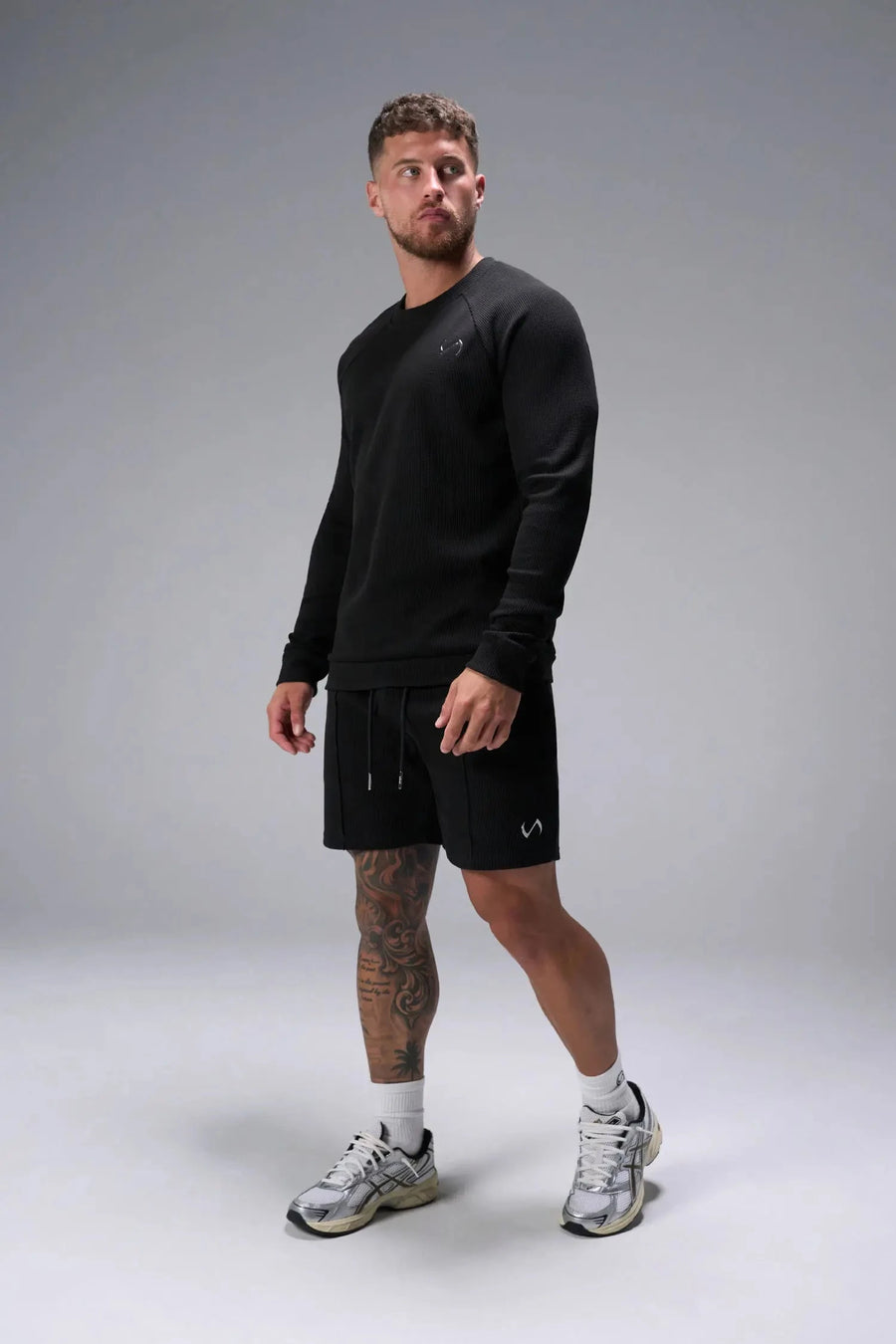 Front View of Black TLF GTS Waffle Tech Shorts, featuring a 7 Inch inseam, an athletic relaxed fit with zipper pockets designed for all day wear