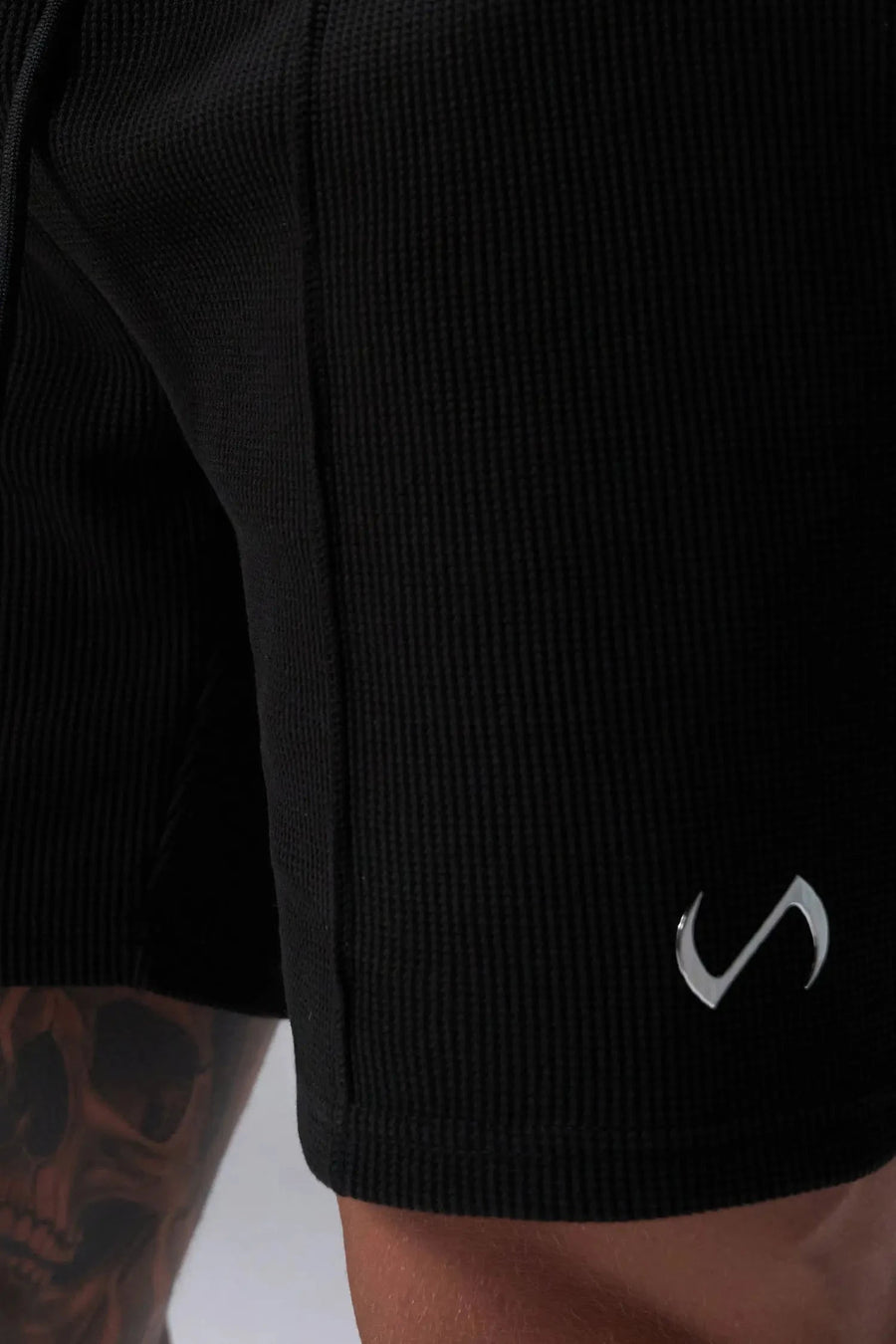 Front View of Black TLF GTS Waffle Tech Shorts, featuring a 7 Inch inseam, an athletic relaxed fit with zipper pockets designed for all day wear