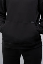 Detail Front View of Black TLF GTS Waffle Tech Hoodie, featuring kangaroo pockets, and double panel hoodie designed for all day wear