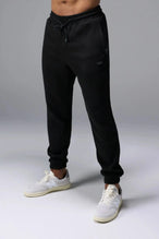 Front View of Black TLF GTS Waffle Tech Joggers, featuring an athletic relaxed fit with zipper pockets designed for all day wear