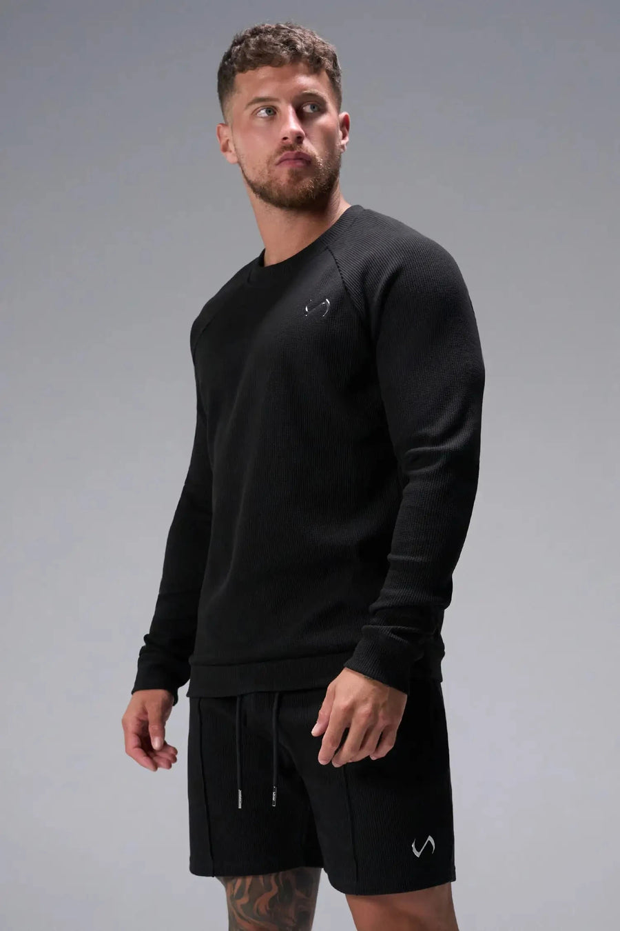 Front View of Black the TLF Waffle Tech Crew Neck featuring a raglan sleeve in our premium waffle knit fabric