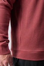 Detail View of Red the TLF Waffle Tech Crew Neck featuring a raglan sleeve in our premium waffle knit fabric
