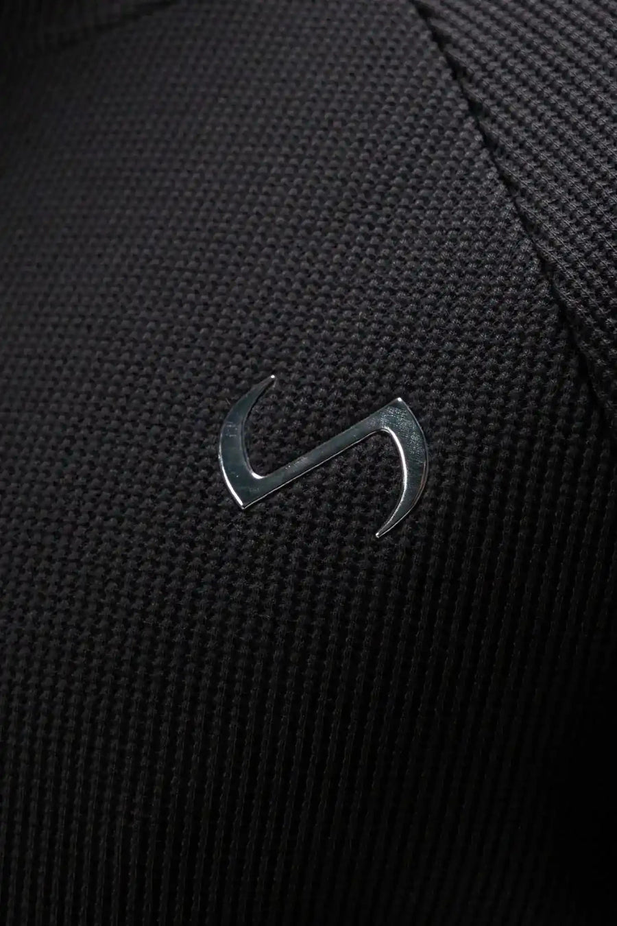 Detail View of Black the TLF Waffle Tech Crew Neck featuring a raglan sleeve in our premium waffle knit fabric