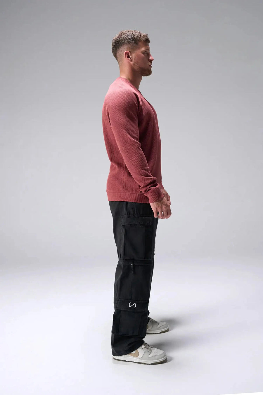 Side View of Red the TLF Waffle Tech Crew Neck featuring a raglan sleeve in our premium waffle knit fabric