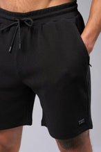 Back View of Black TLF GTS Waffle Tech Shorts, featuring a 6” Inch inseam, an athletic relaxed fit with zipper pockets designed for all day wear
